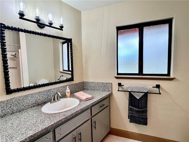 bathroom featuring vanity and a healthy amount of sunlight