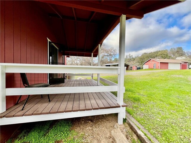 wooden terrace with a yard