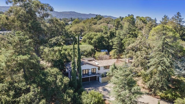 birds eye view of property with a mountain view