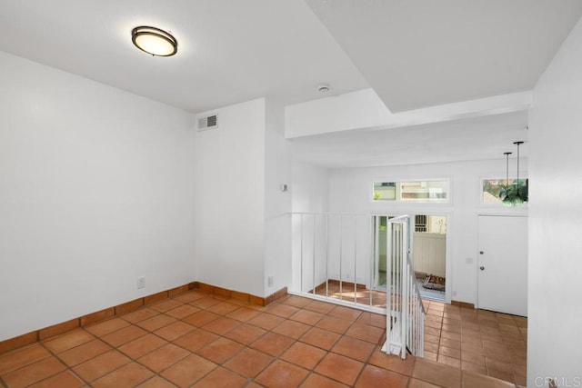 spare room featuring tile patterned flooring