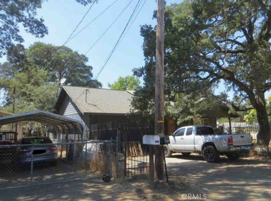 view of vehicle parking with a carport