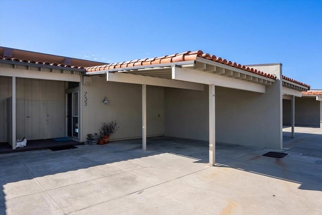 exterior space featuring a carport