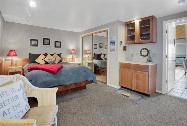 carpeted bedroom with a closet