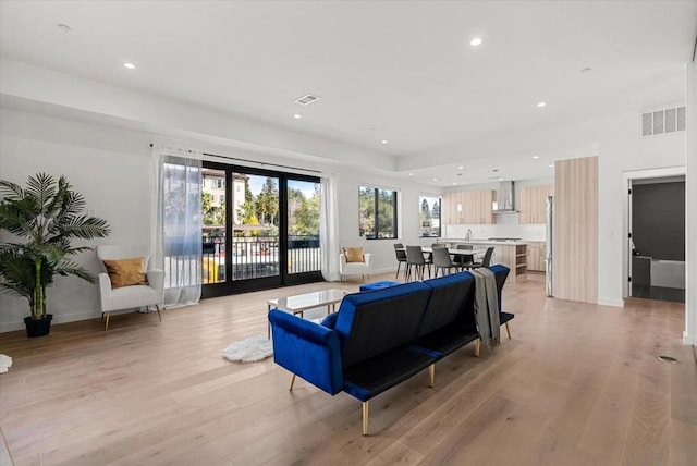 living room with light hardwood / wood-style flooring