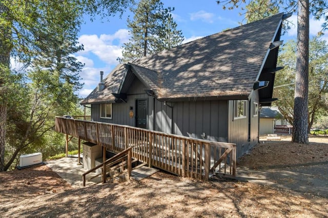 rear view of property with a deck