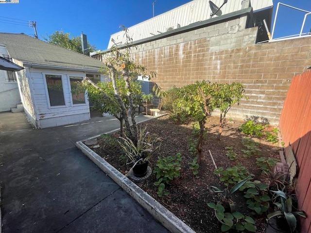 view of side of property featuring a patio area