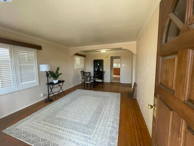 entrance foyer featuring dark hardwood / wood-style floors and crown molding