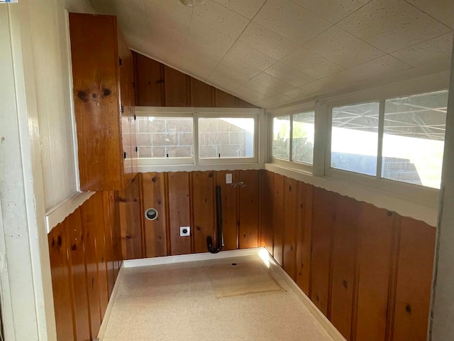 unfurnished sunroom with vaulted ceiling