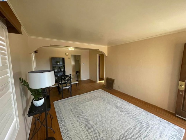 interior space with crown molding and dark hardwood / wood-style flooring