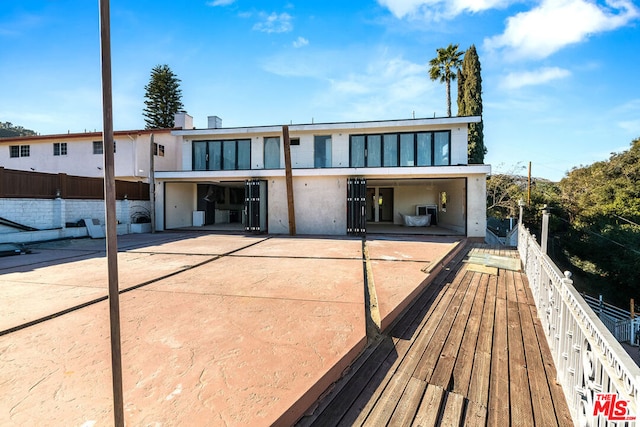 back of house with a patio area