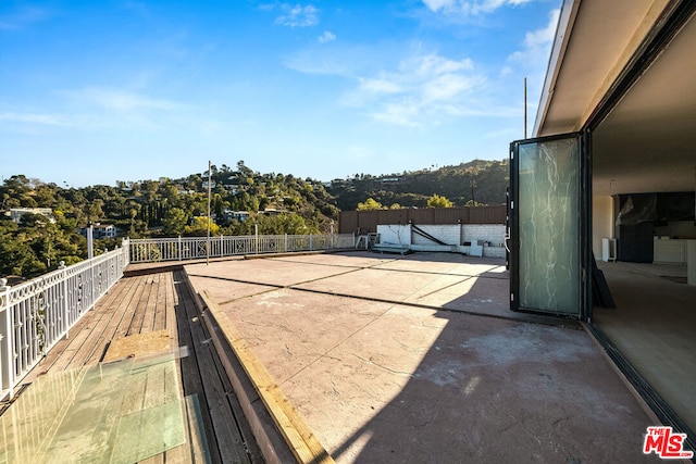 view of patio with a balcony