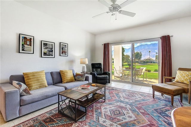 living room with ceiling fan and light tile patterned floors