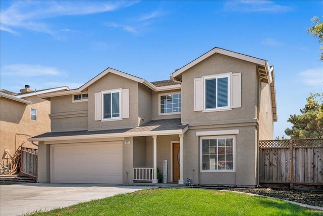 view of front of house featuring a garage and a front lawn