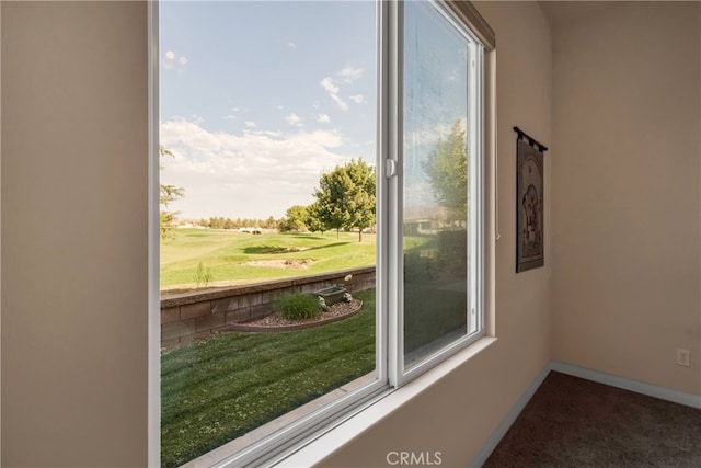 doorway to outside with carpet floors