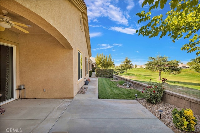 view of patio featuring ceiling fan