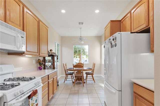 kitchen with ceiling fan, white appliances, and light tile patterned floors