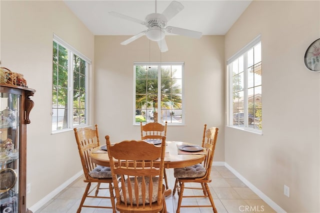 dining area featuring ceiling fan and light tile patterned floors