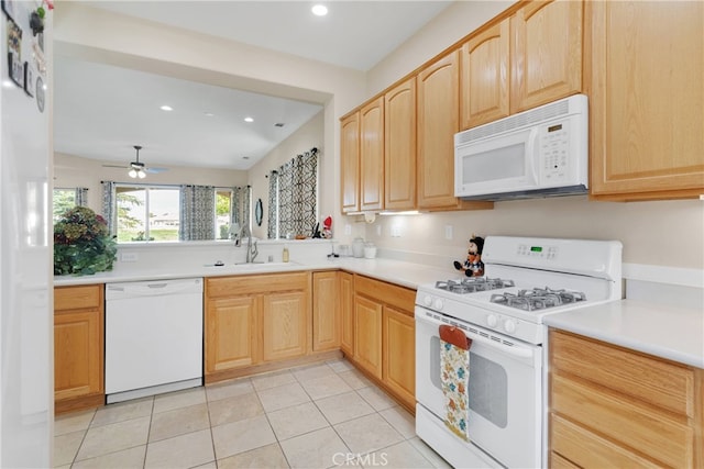 kitchen with light brown cabinetry, ceiling fan, white appliances, and light tile patterned floors