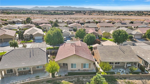 birds eye view of property featuring a mountain view