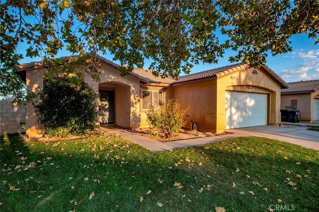 view of front of home with a garage and a front yard