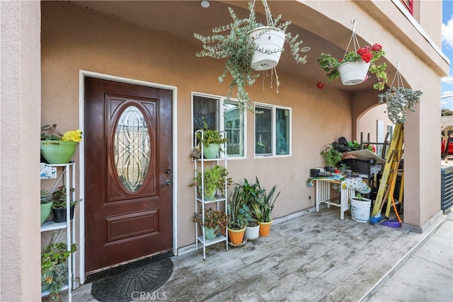 doorway to property with a patio area