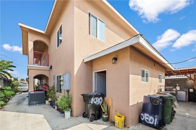 rear view of property with a balcony