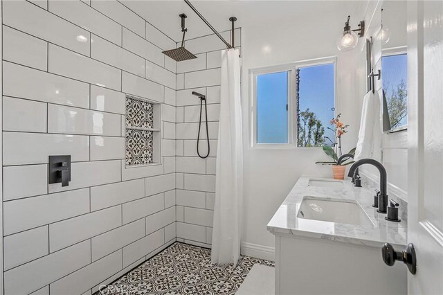 bathroom with vanity and walk in shower