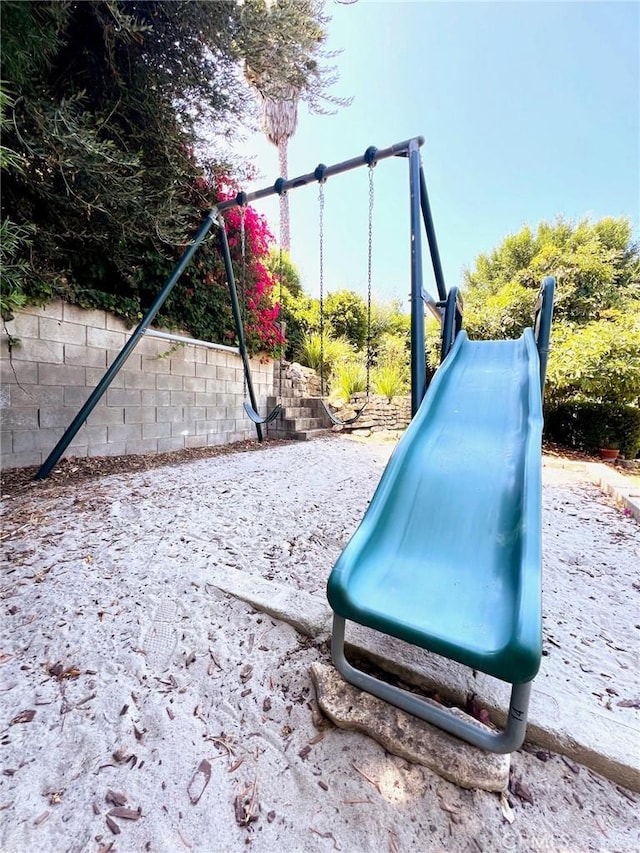 view of play area with a fenced backyard