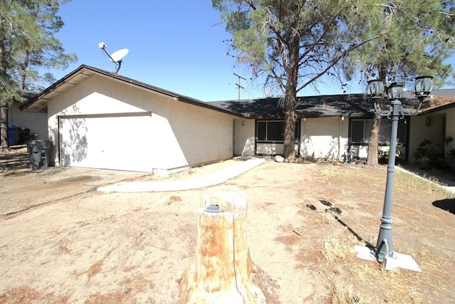 ranch-style home with a garage