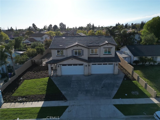 view of front facade with a front yard and a garage