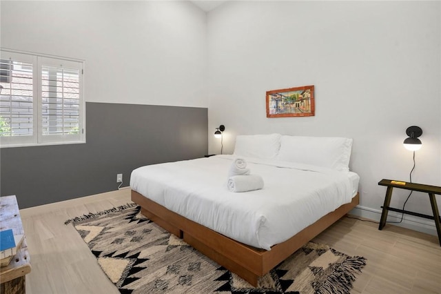 bedroom with light hardwood / wood-style flooring