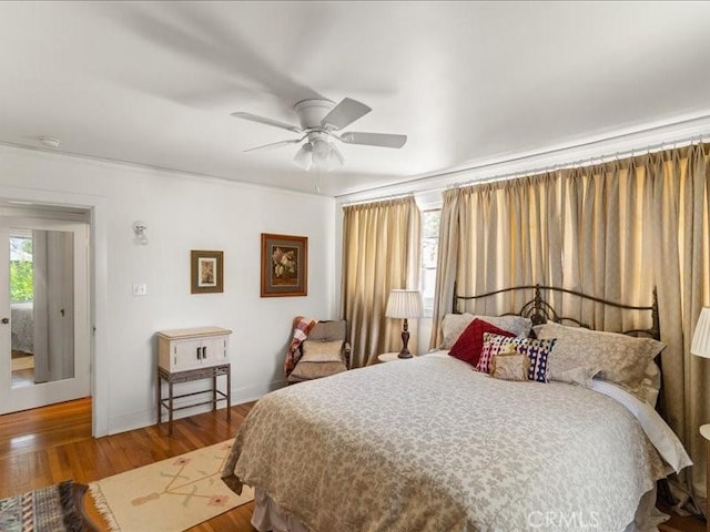 bedroom with hardwood / wood-style flooring and ceiling fan