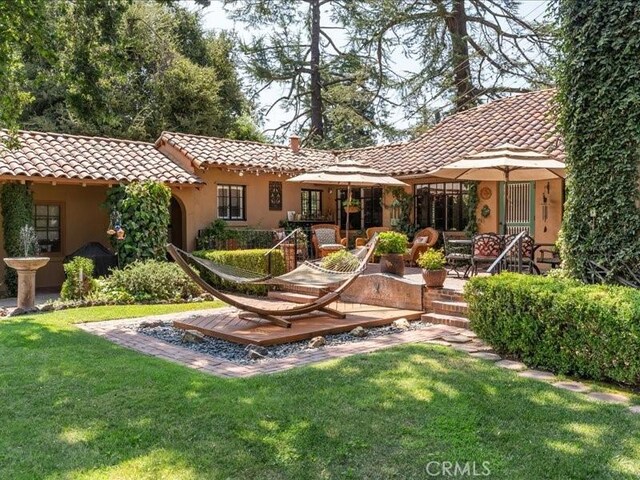 back of house featuring a yard and a patio