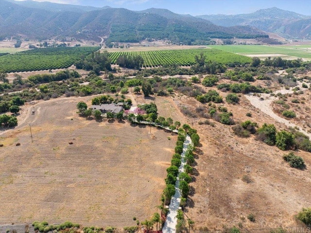 drone / aerial view with a mountain view and a rural view