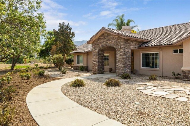 mediterranean / spanish home with a patio