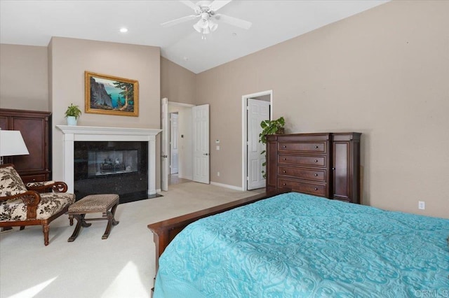 carpeted bedroom with vaulted ceiling and ceiling fan