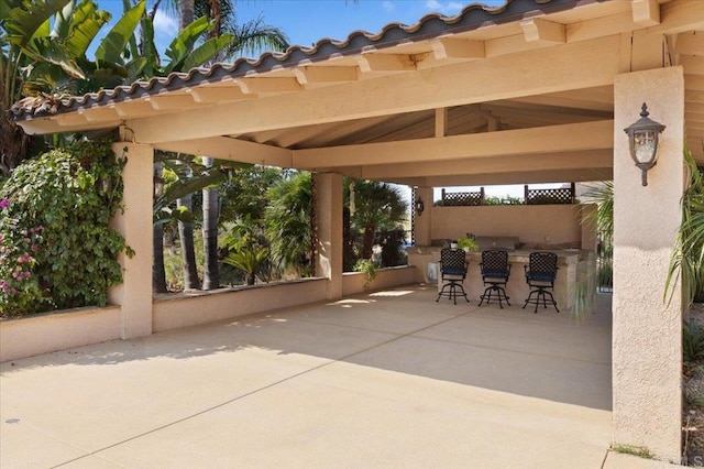 view of patio with an outdoor bar