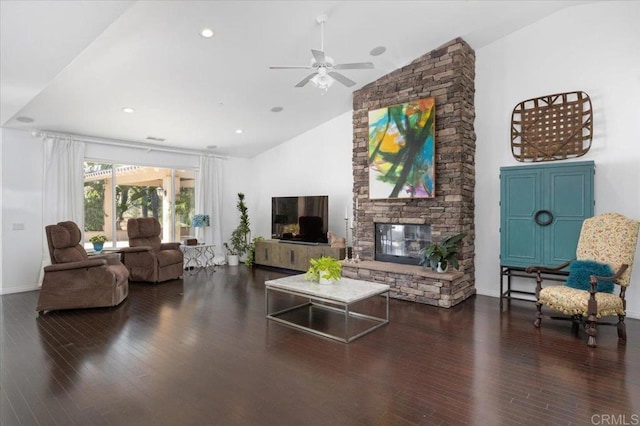 living room with ceiling fan, a fireplace, dark hardwood / wood-style floors, and high vaulted ceiling