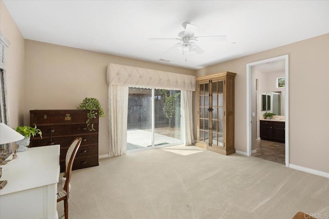 office area with light colored carpet and ceiling fan