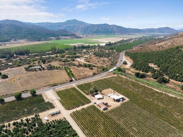 drone / aerial view featuring a rural view and a mountain view