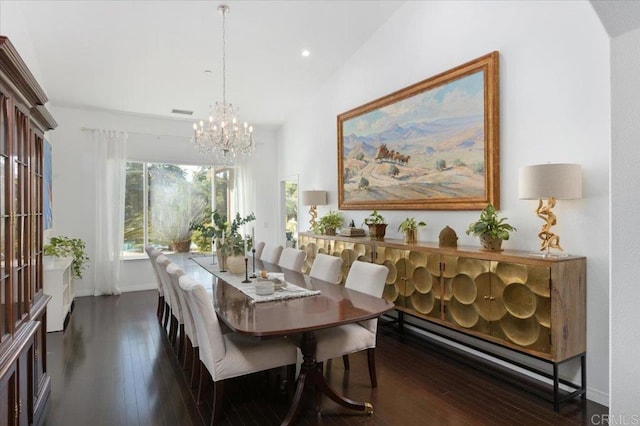 dining room featuring vaulted ceiling, a chandelier, and dark hardwood / wood-style flooring