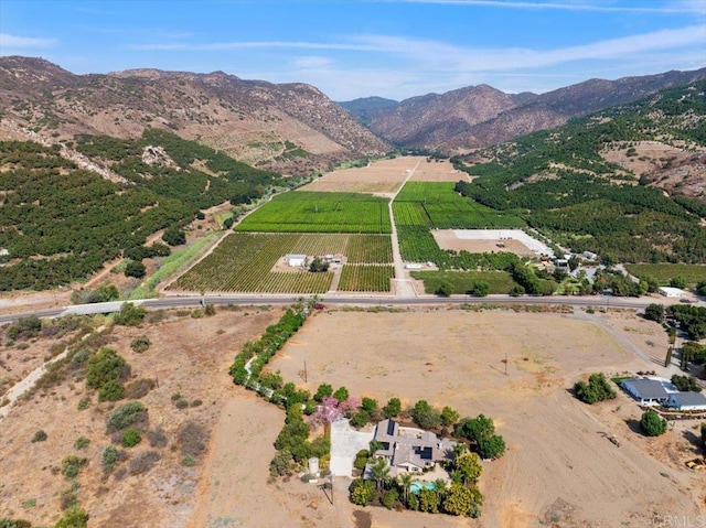 birds eye view of property with a rural view and a mountain view