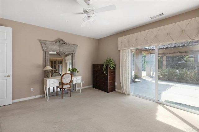 office area featuring ceiling fan and light carpet