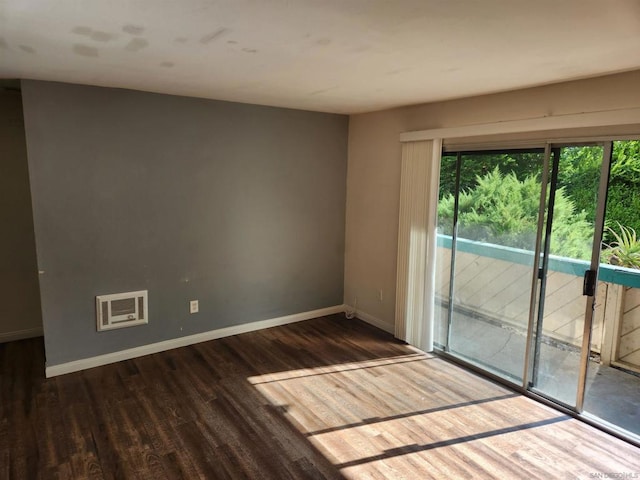 unfurnished room with dark hardwood / wood-style floors