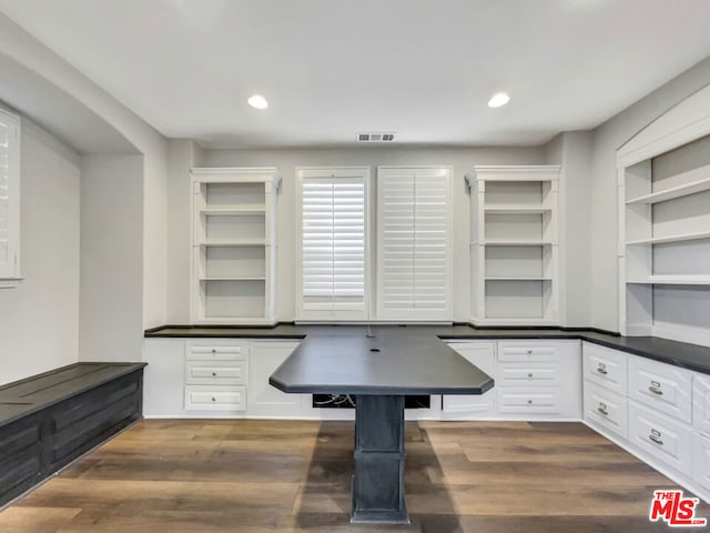 office with dark hardwood / wood-style floors