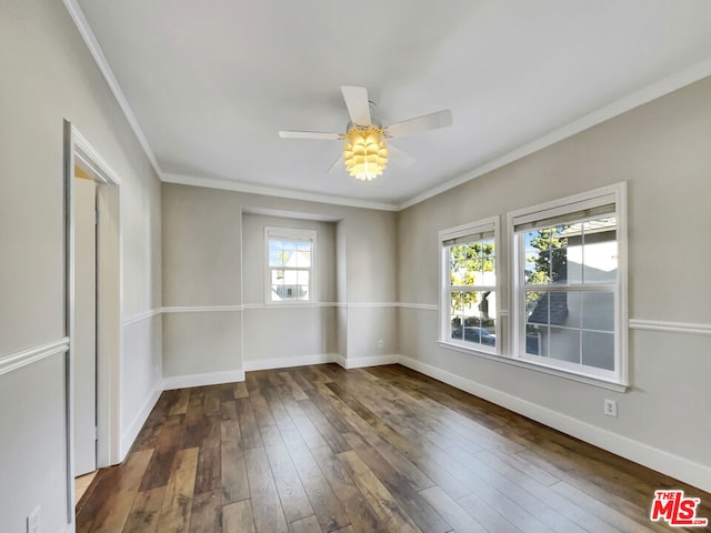 empty room featuring ceiling fan, dark hardwood / wood-style flooring, and ornamental molding