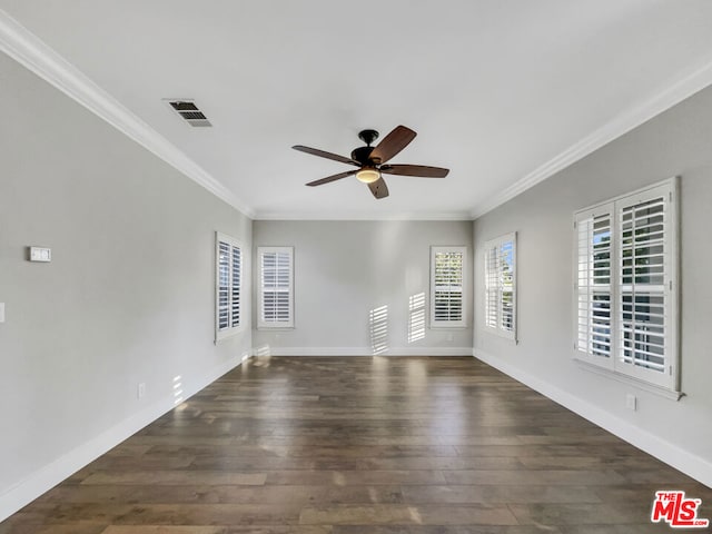 empty room featuring dark hardwood / wood-style floors, ceiling fan, and ornamental molding