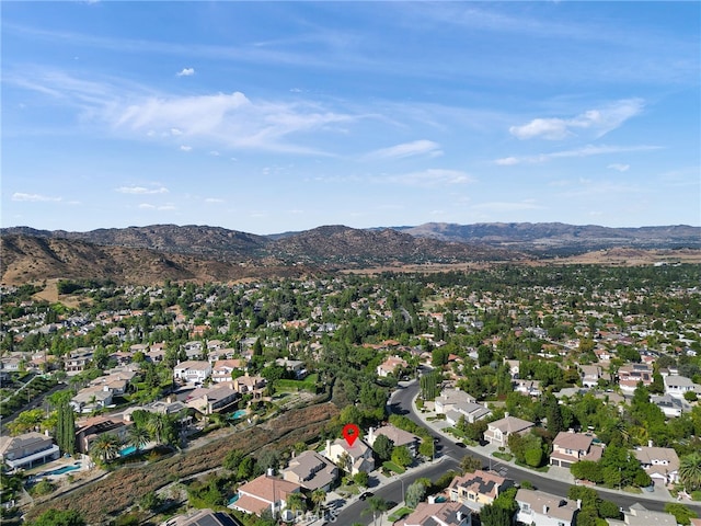 birds eye view of property featuring a mountain view