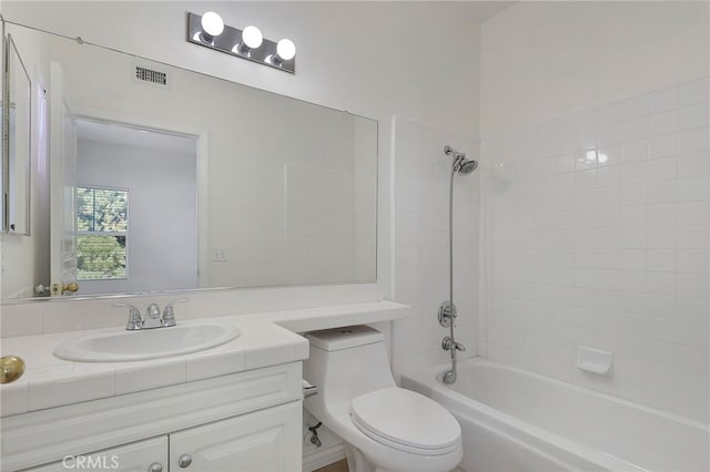 full bathroom with vanity,  shower combination, and toilet