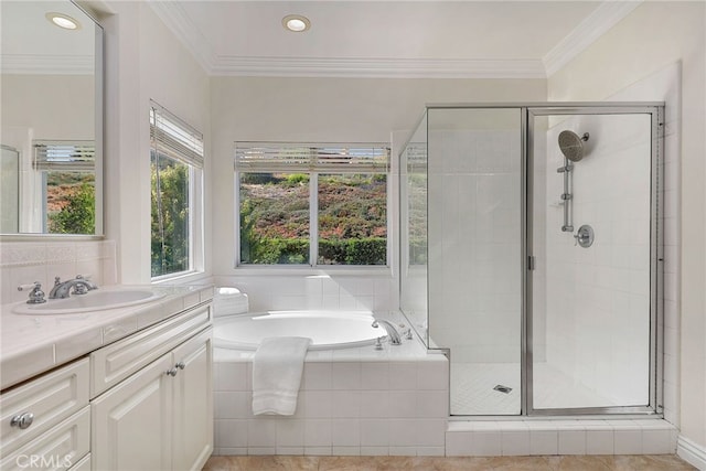 bathroom with independent shower and bath, ornamental molding, tile patterned flooring, and vanity